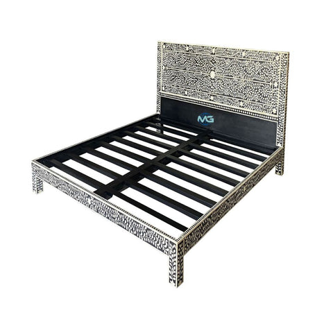 Image of the Handmade Bone Inlay Bed & Headboard Furniture by matrixglobalmarket. It features a tall headboard with a rectangular design and horizontal stripes, showcasing the initials "MG" at its center. The bed's slats are visible, adding to its distinctive style.